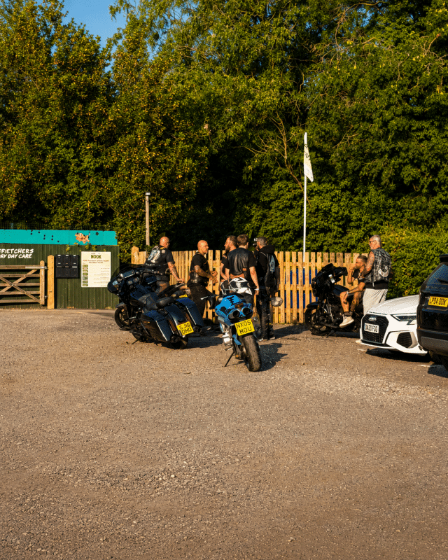 Motorcycle riders gathered beside their bikes at Buckovers Bike Night in Milbury Heath near Thornbury.